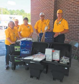 15Alabama Baptist volunteers with donations from Lowes