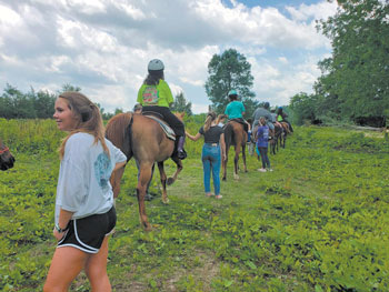 10 2 people with horses