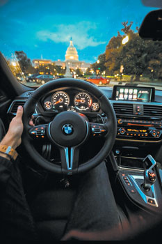 04 person holding bmw steering wheel 2526128